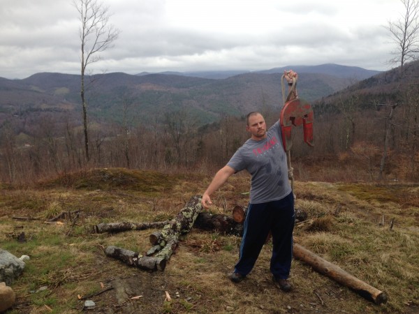 At the top of the mountain, where Death Race challenges are held, holding up a 70 lb Spartan Helmet!